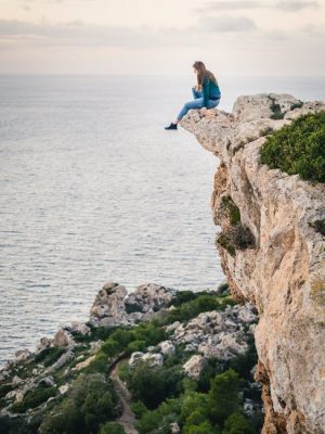 girl-on-cliff-looking-out