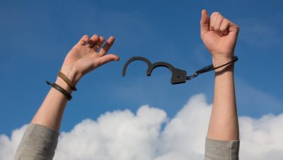 woman breaking out of handcuff