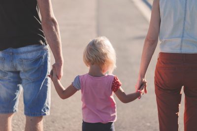 family little girl holding hands