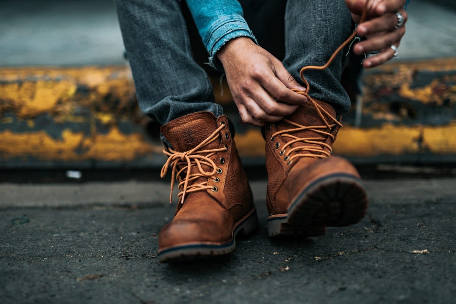 Man wearing a pair of brown boots.